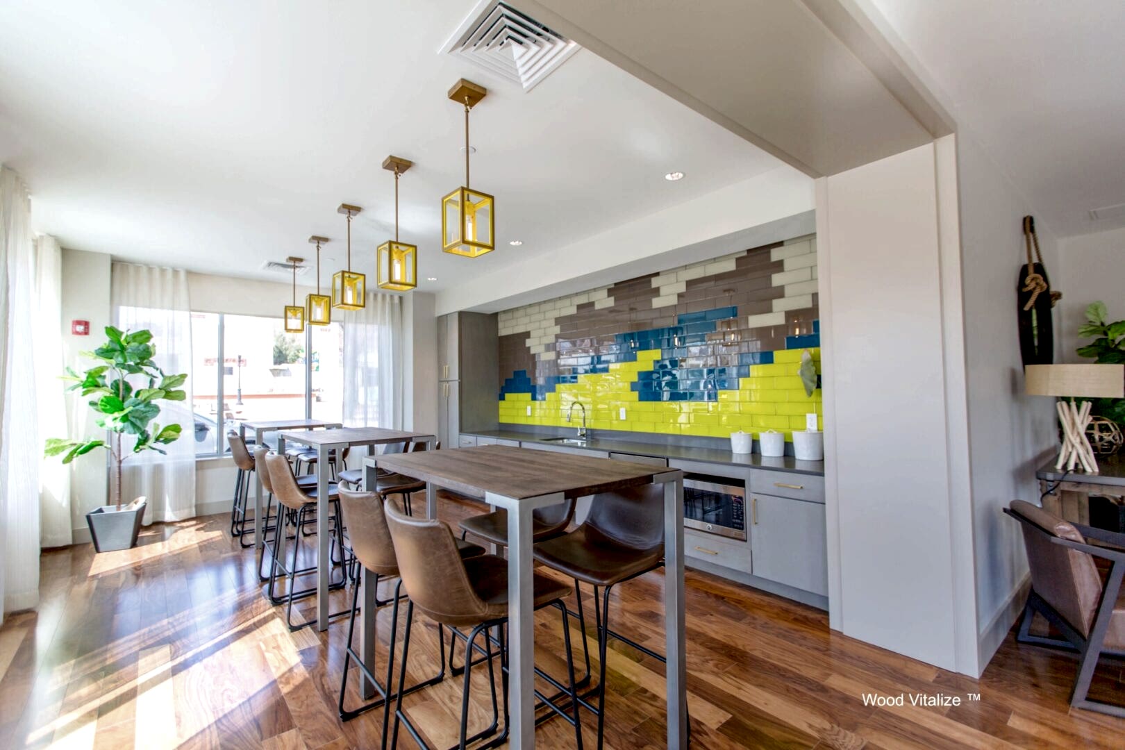 Modern dining area with yellow pendant lights
