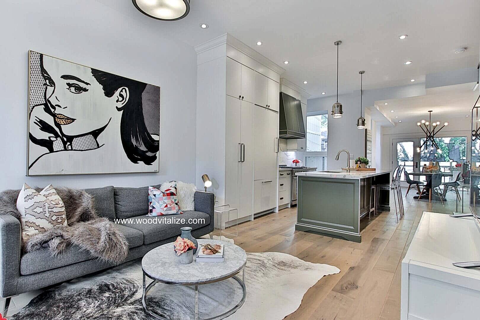 Open concept living room with light hardwood