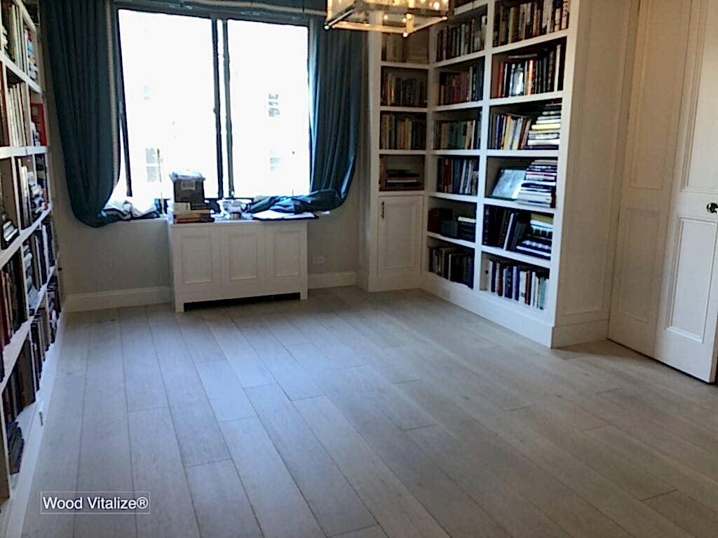 Bright room with bookshelves and window.