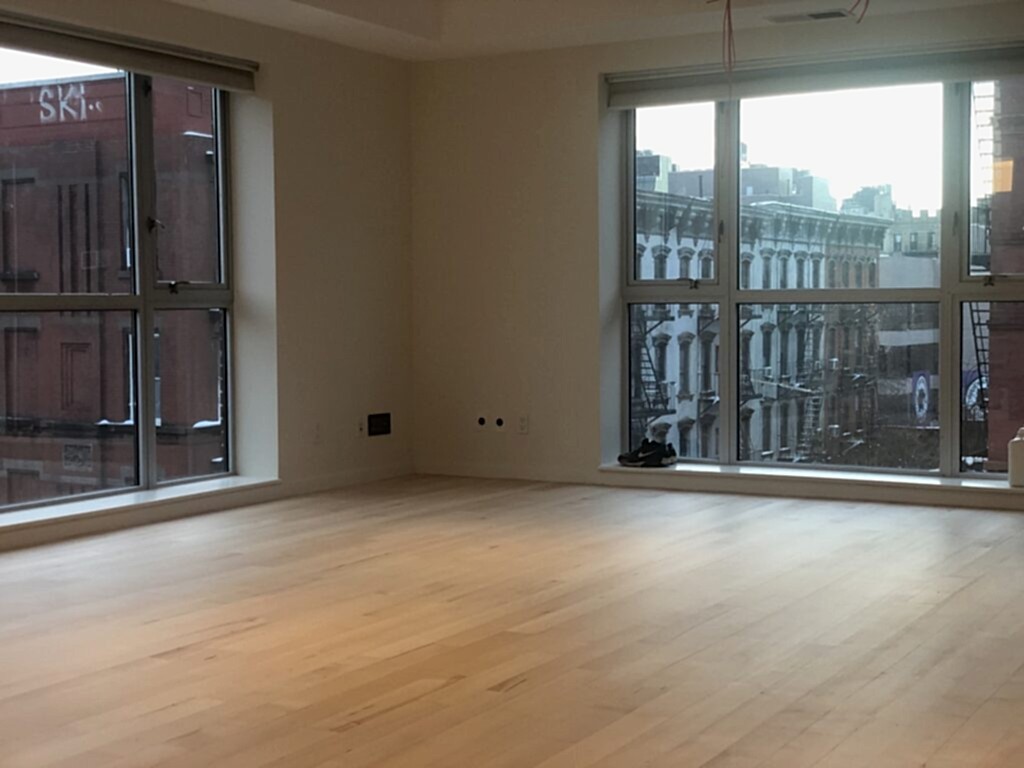 Empty apartment with light hardwood floors